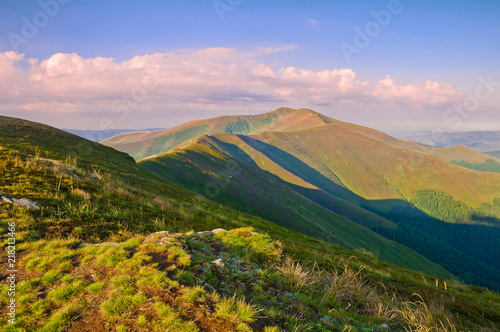 View of the mountain range at sunrise. Summer mountain landscape