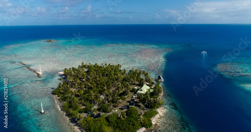 small islands (motu) in the middle of a lagoon in aerial view, French Polynesia