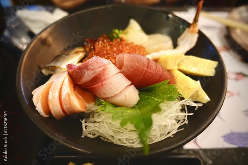 Japanese food. sushi and sashimi big set include salmon, tuna, otoro and lobster, Asian people eating sashimi set in Asian restaurant. Hirame sashimi,salmon sashimi and tuna sashimi dish.