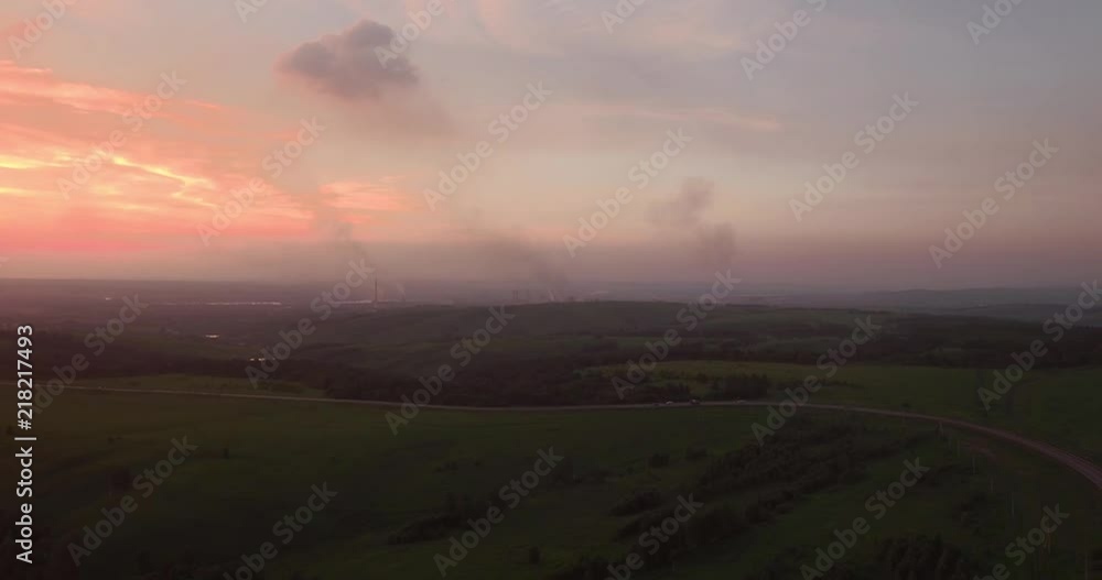 Aerial View over the hills with smog at sunset. air pollution around the industrial city. 4K Aerial View over the hills with smog at sunset. air pollution around the industrial city. 4K