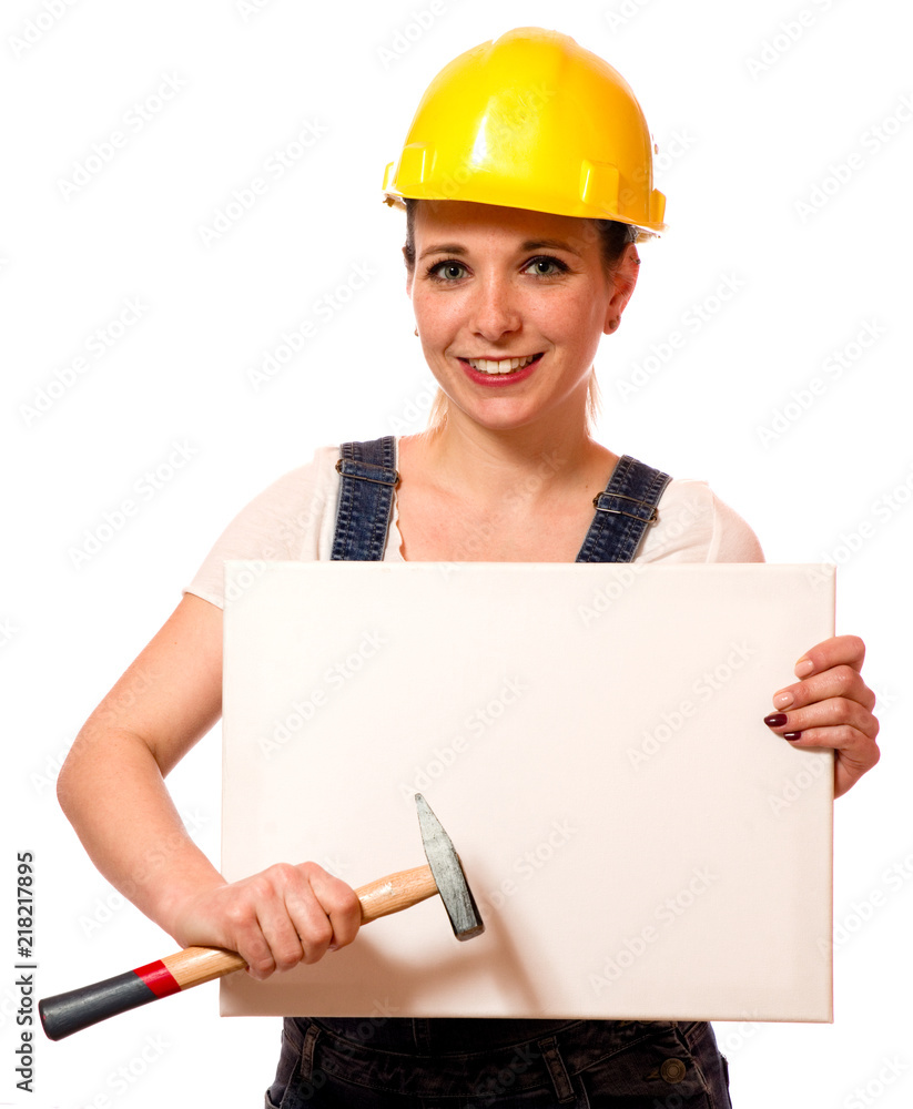 Junge Frau mit Bauhelm und Schild 