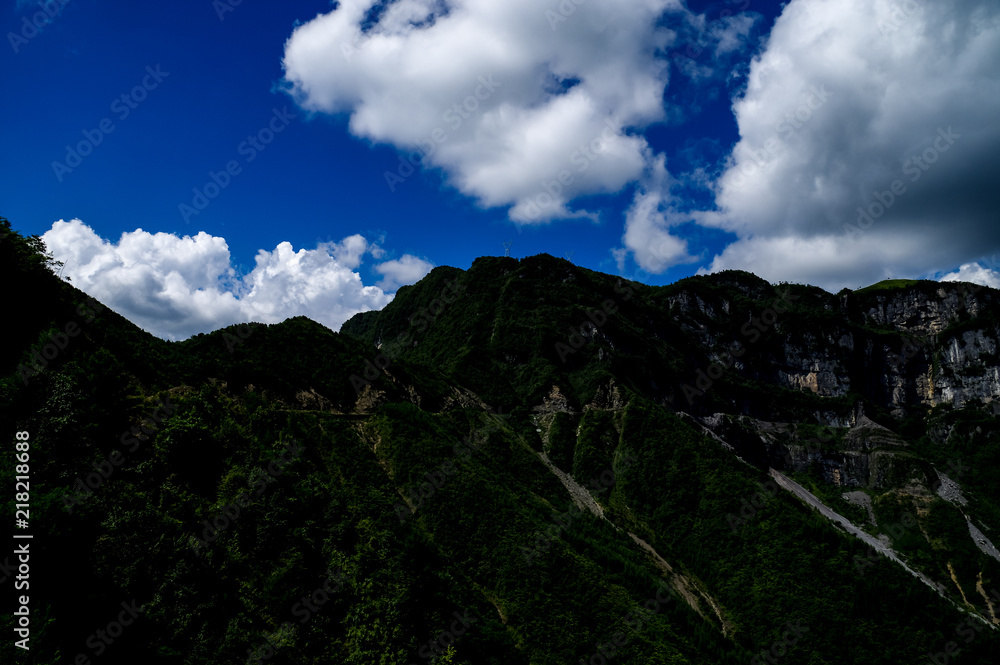 View of Beautiful Mountains under a Fleece of White Clouds View of Beautiful Mountains under a Fleece of White Clouds