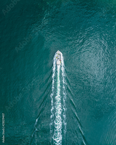 Boat going out of the harbour photo