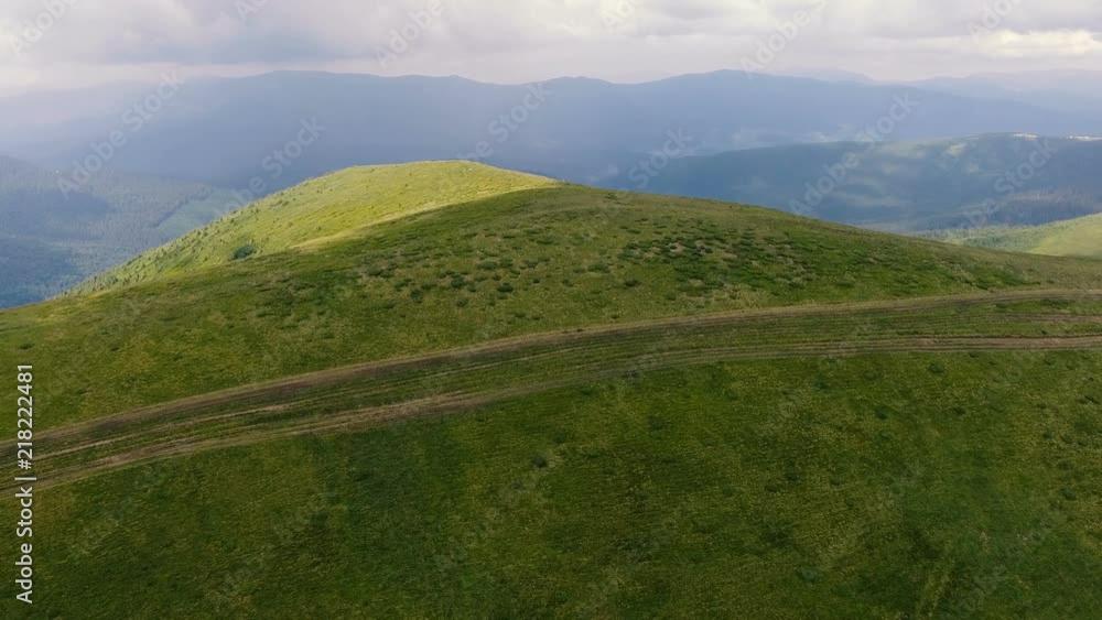 Aerial shot of the Carpathian highlands with two country roads in summer Aerial shot of the Carpathian highlands with two country roads in summer
