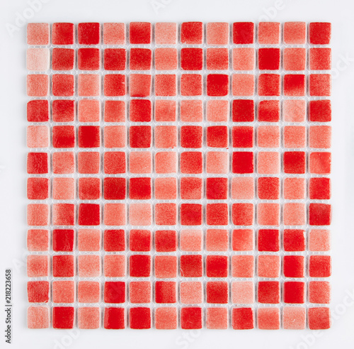 little red ceramic tile on a white background, top view, majolica. for the catalog
