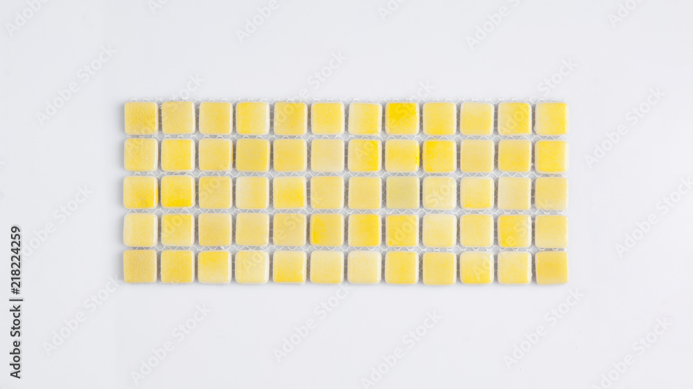 little yellow ceramic tile on a white background, top view, majolica. for the catalog
