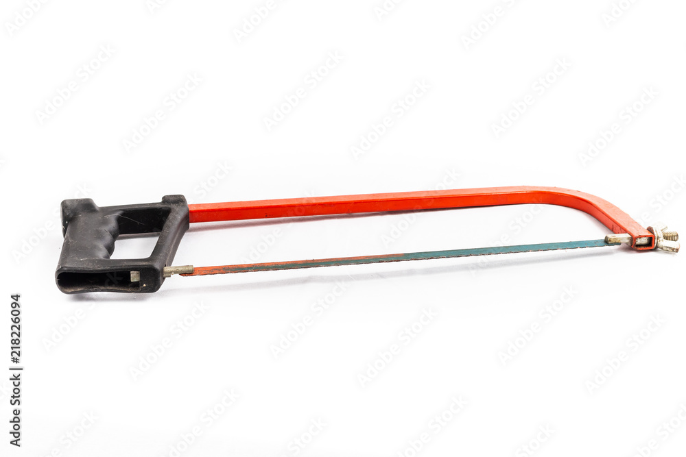 red hacksaw on a white background in studio