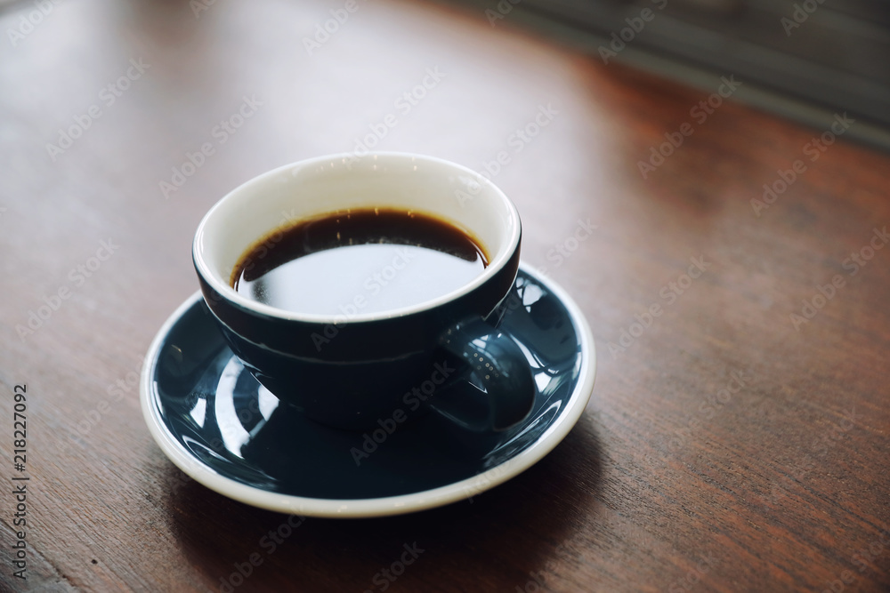 Black coffee in Coffee cup on wood background Black coffee in Coffee cup on wood background