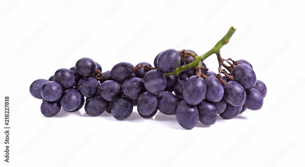 Blue wet Isabella grapes bunch isolated on white background