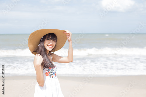 Beautiful girl enjoy and happy on the beach, Hua Hin, Thailand