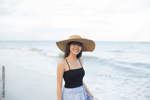Young girl enjoy and happy her relaxing on the beach, Hua Hin, Thailand