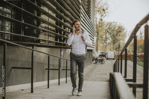 Stylish businessman walking...