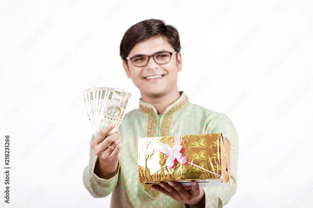 Indian man holding Indian currency note in hand Indian man holding Indian currency note in hand