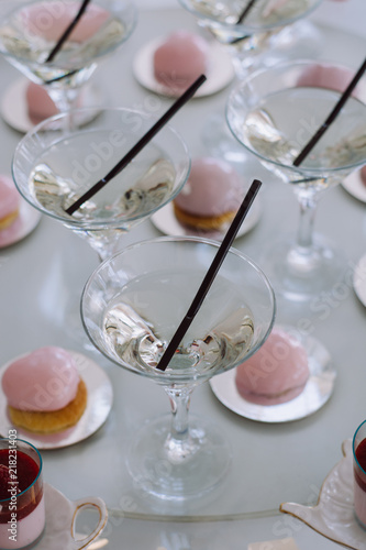 Row of martini glasses  on  bar. Celebration or other event.