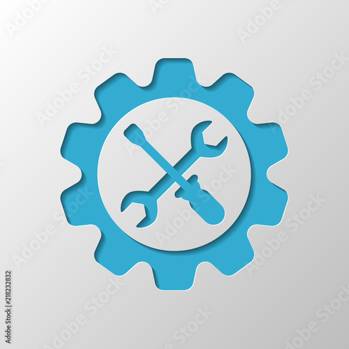 Wrench and screwdriver in gear. Paper design. Cutted symbol with