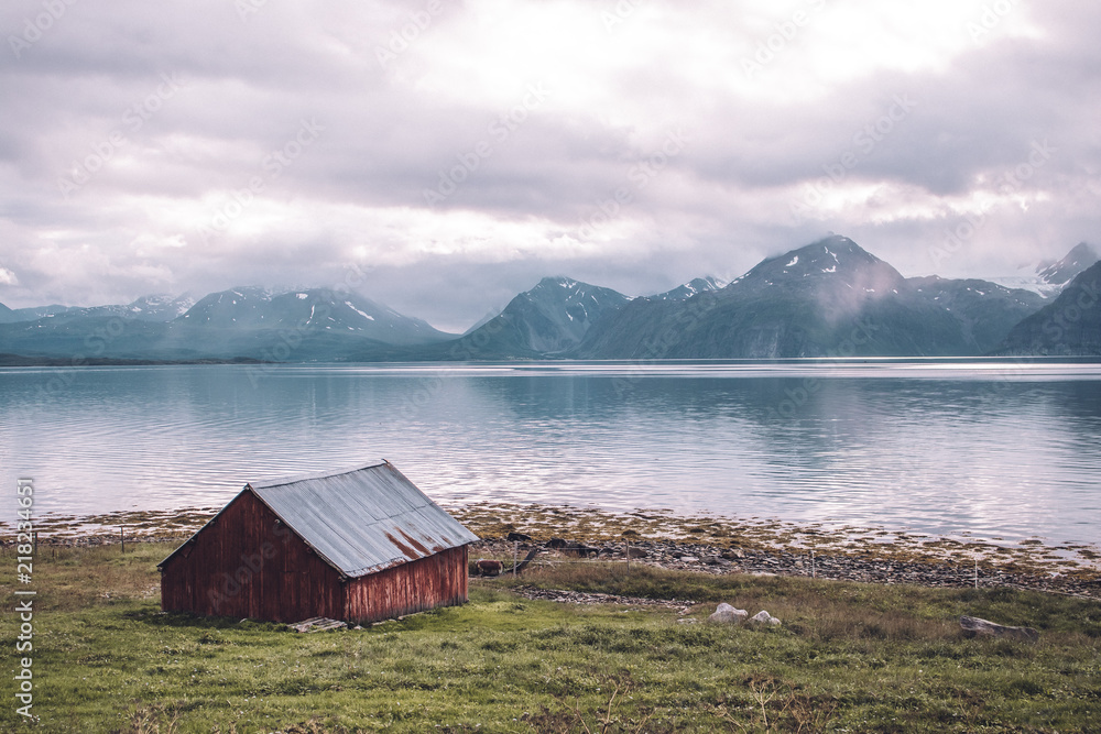 a red fishing cabin in norway