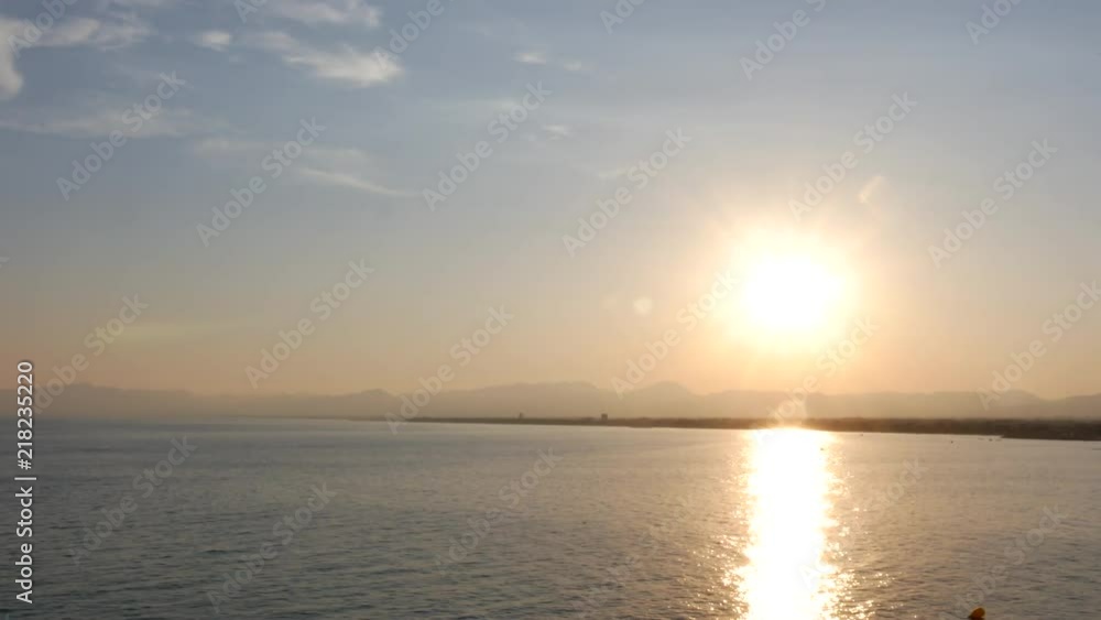Beautiful sunrise on a calm Mediterranean beach Beautiful sunrise on a calm Mediterranean beach