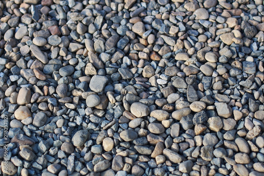 Background of the grey and brown round gravel on the floor Background of the grey and brown round gravel on the floor