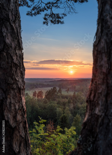 Scenery landscape view with beautiful sunset and evening light at summer in Finland © Jani Riekkinen