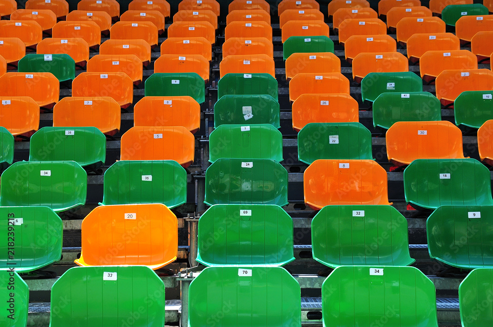 Fototapeta premium numbered plastic seats at open air grandstand