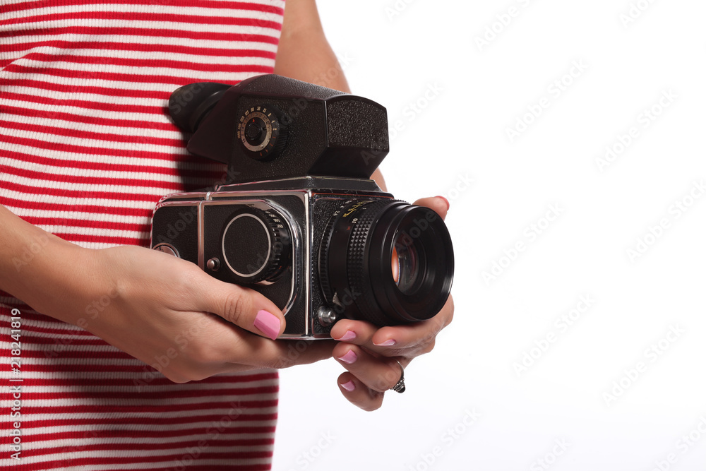 Women's hands with an old camera. - obrazy, fototapety, plakaty 