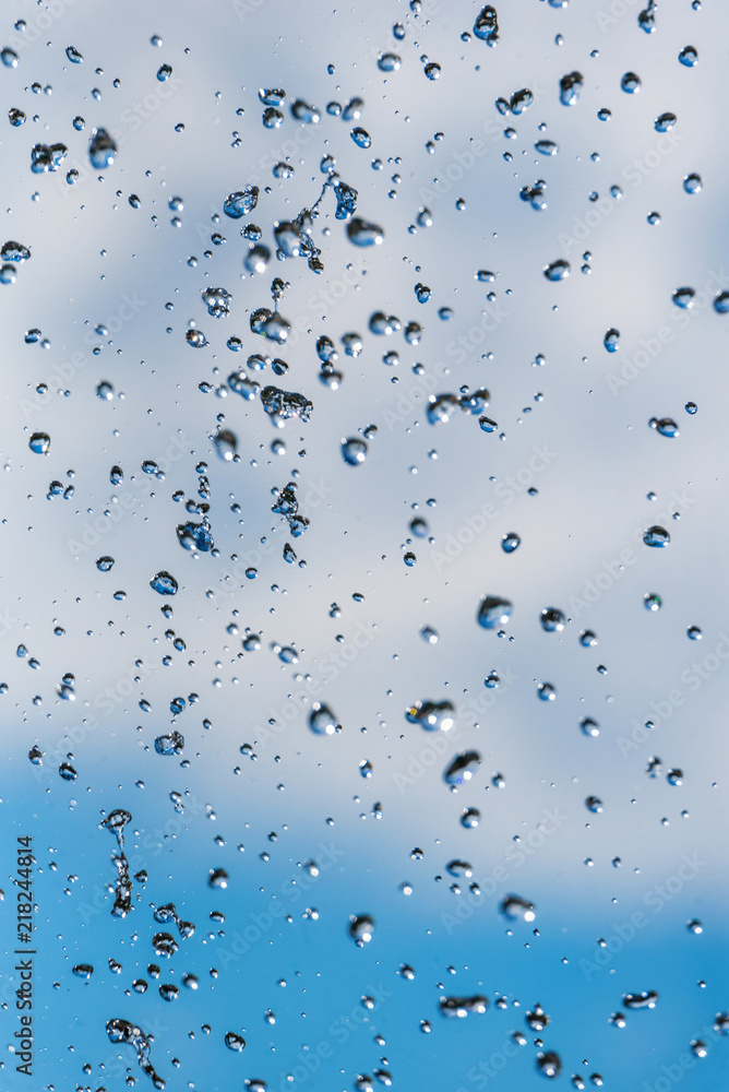 drops of a fountain against the sky drops of a fountain against the sky