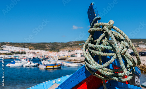 Traditional fishing boats at marina in Sesimbra, Portugal photo