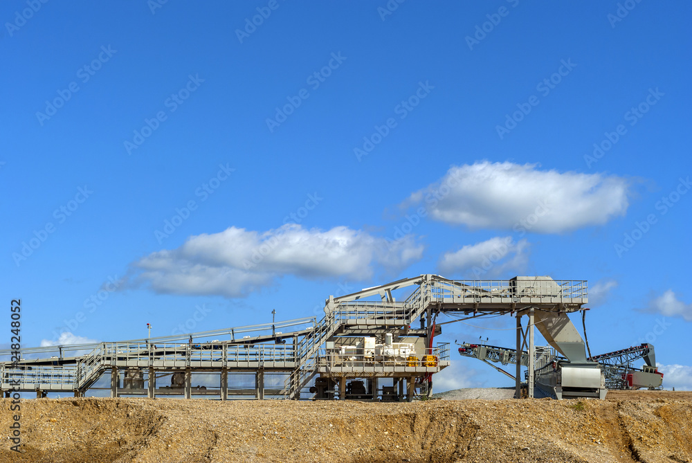 gravel sorting conveyor machine under an open sky