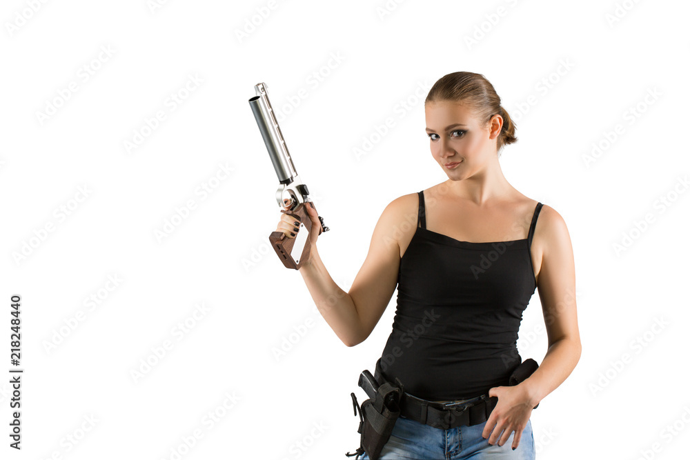 Young beautiful woman holding a gun on white background Young beautiful woman holding a gun on white background