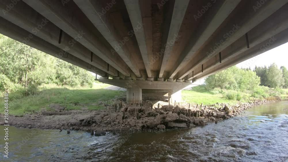 Reinforced concrete bridge from below close-up. Automobile bridge from below Reinforced concrete bridge from below close-up. Automobile bridge from below