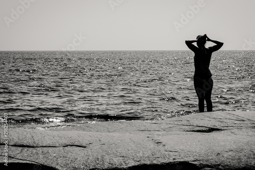 Silhouette of woman standin...
