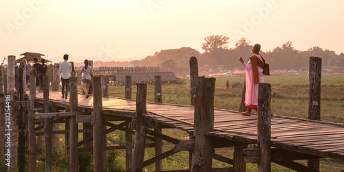 People walking on U Bein Bridge at sunset  Amarapura  Myanmar                                                
