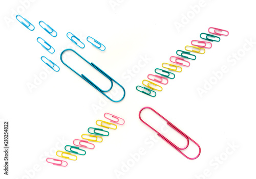 Paper clips on a white background metaphora for fertilization fertility photo