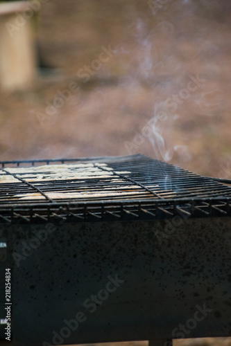 smoke over a barbecue outdoors