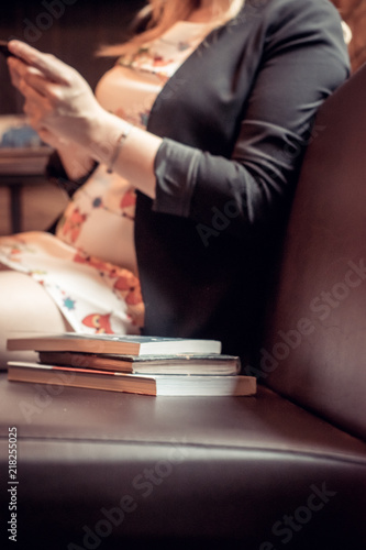 woman resting in a café during lunch with a phone