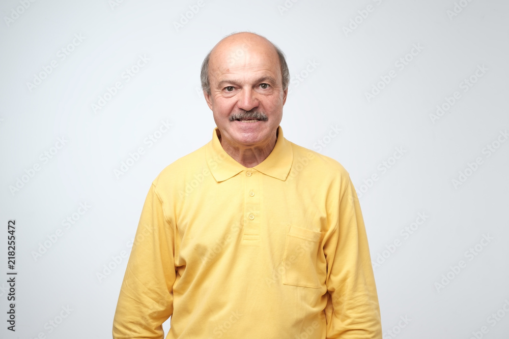 Fototapeta premium Very angry aggressive european man portrait on gray background