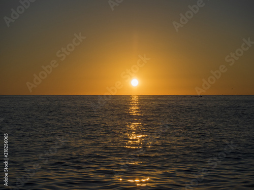 Beautiful sea sunset in warm orange color © jockermax3d