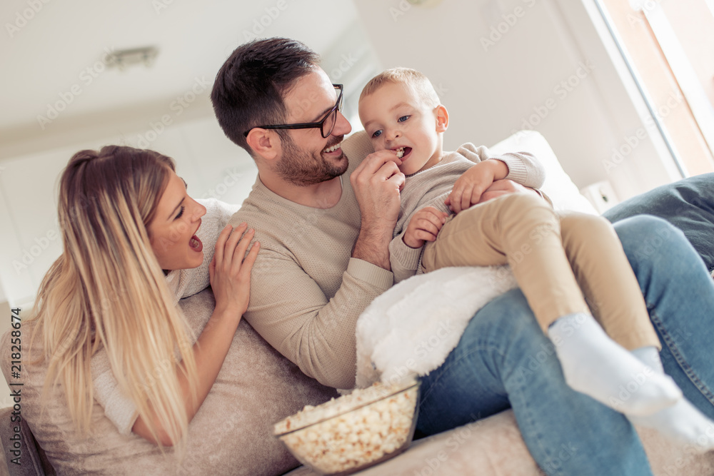 Young family watching movie together Young family watching movie together