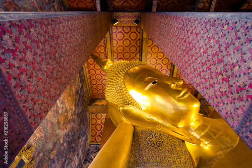 Photography big golden buddha head in Wat Pho buddhist temple in Bangkok , Thailand