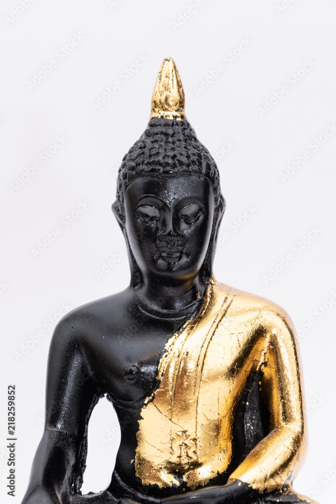 Black marble and golden buddha statue coated in golden