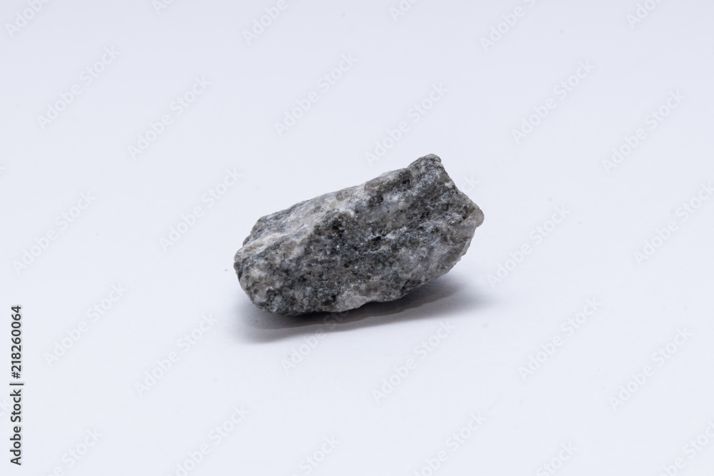 Granite rock stone little bolder in front of white Granite rock stone little bolder in front of white
