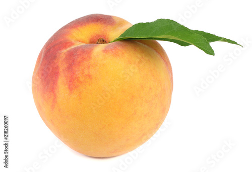 peach fruit with green leaf isolated on white background