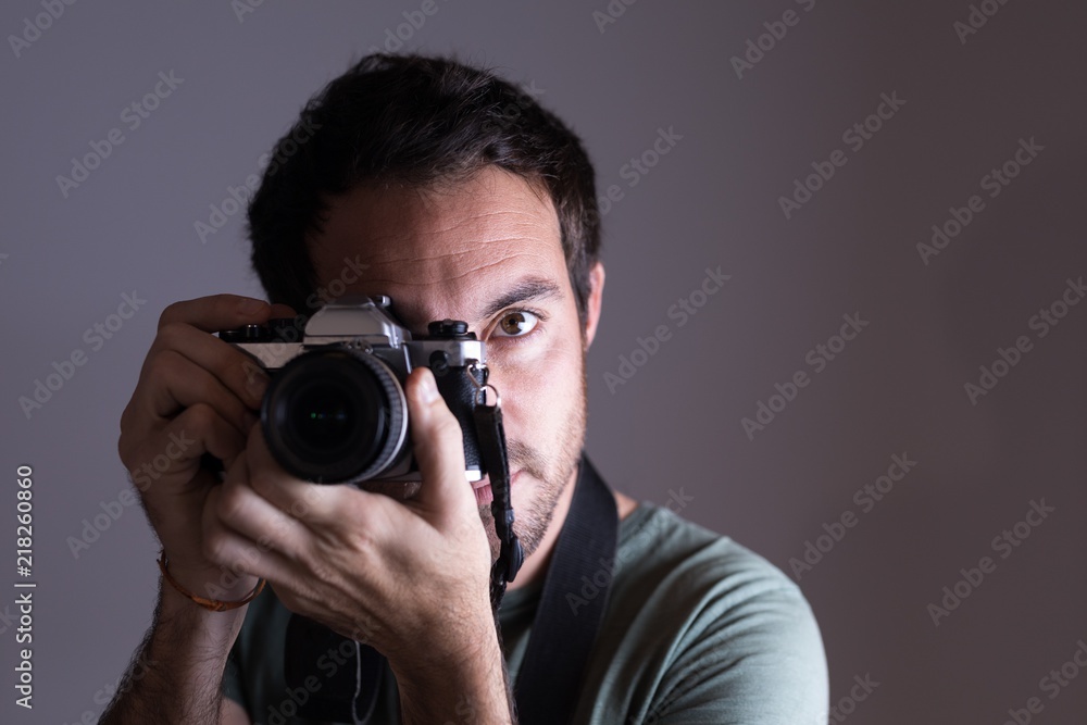Male photographer clicking photos with camera Male photographer clicking photos with camera