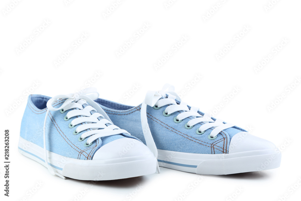 Pair of blue sneakers isolated on white background