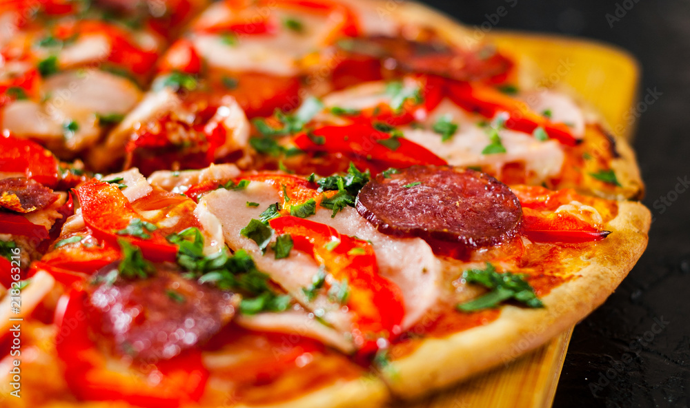 slices of Pizza with Mozzarella cheese, Ham, Tomatoes, salami, pepper, pepperoni Spices and Fresh Basil. Italian pizza slices of Pizza with Mozzarella cheese, Ham, Tomatoes, salami, pepper, pepperoni Spices and Fresh Basil. Italian pizza