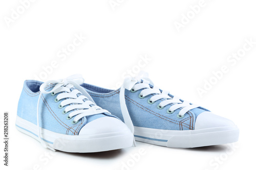 Pair of blue sneakers isolated on white background