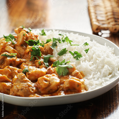 plate of indian curry with basmati rice and chicken