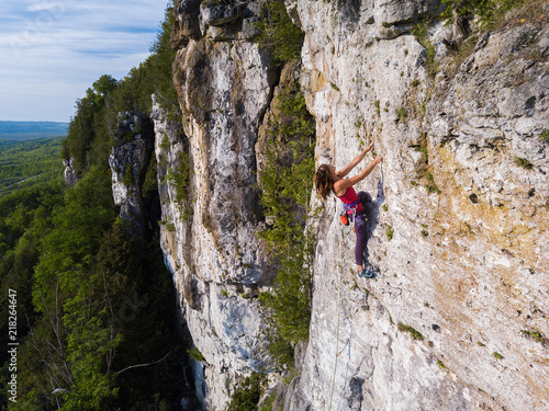 A beautiful woman rock climbing in Ontario, Canada.