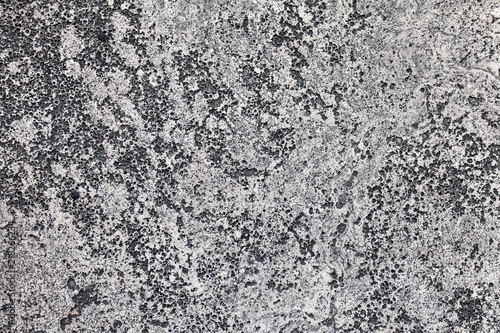 Old concrete wall with cracks. Aged cracked plaster wall background and textu...