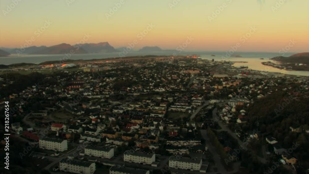 Beautiful, WIDE ANGLE view of Lofoten at sunset looking down from the mountains out to sea. Steep mountains rise up in the distance. TILT UP. Beautiful, WIDE ANGLE view of Lofoten at sunset looking down from the mountains out to sea. Steep mountains rise up in the distance. TILT UP.